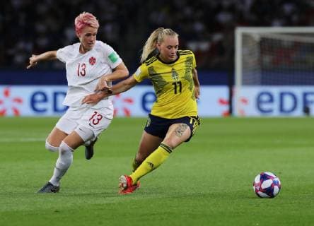 (190625) -- PARIS, June 25, 2019 -- Stina Blackstenius (R) of Sweden vies with Sophie Schmidt of Canada during the round of 16 match between Sweden and Canada at the 2019 FIFA Women s World Cup in Parc des Princes in Paris, France, June 24, 2019. Sweden won 1-0. ) (SP)FRANCE-PARIS-FIFA WOMEN S WORLD CUP-ROUND OF 16-SWE VS CAN GaoxJing 