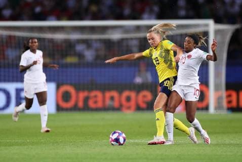 (190625) -- PARIS, June 25, 2019 -- Fridolina Rolfo (2nd R) of Sweden vies with Ashley Lawrence (1st R) of Canada during the round of 16 match between Sweden and Canada at the 2019 FIFA Women s World Cup in Parc des Princes in Paris, France, June 24, 2019. Sweden won 1-0. ) (SP)FRANCE-PARIS-FIFA WOMEN S WORLD CUP-ROUND OF 16-SWE VS CAN GaoxJing 