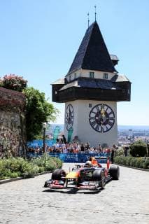 FORMULA 1 - Projekt Spielberg, media day GRAZ,AUSTRIA,26.JUN.19 - MOTORPORTS, FORMULA 1 - Projekt Spielberg, media day, showrun with Max Verstappen. Image shows Max Verstappen (NLD Red Bull Racing) in an RB 7, the clocktower and fans. GEPAxpictures xMarioxBuehner