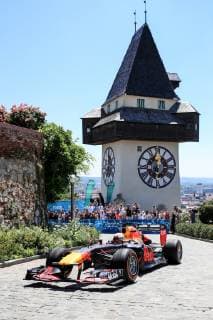 FORMULA 1 - Projekt Spielberg, media day GRAZ,AUSTRIA,26.JUN.19 - MOTORPORTS, FORMULA 1 - Projekt Spielberg, media day, showrun with Max Verstappen. Image shows Max Verstappen (NLD Red Bull Racing) in an RB 7, the clocktower and fans. GEPAxpictures xMarioxBuehner