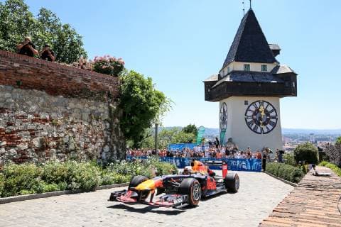 FORMULA 1 - Projekt Spielberg, media day GRAZ,AUSTRIA,26.JUN.19 - MOTORPORTS, FORMULA 1 - Projekt Spielberg, media day, showrun with Max Verstappen. Image shows Max Verstappen (NLD Red Bull Racing) in an RB 7, the clocktower and fans. GEPAxpictures xMarioxBuehner
