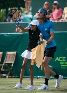 Stefanos Tsitsipas of Greece lets a ballgirl play part of the game for him during The BOODLES Tennis exhibition event 2019 at Stoke Park, Slough, England on 26 June 2019. Copyright: xAndyxRowlandx PMI-2882-0002
