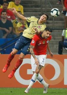 Colombia vs. Chile SÃO PAULO, SP - 28.06.2019: COLOMBIA VS. CHILE - Stefan Medina of Colombia contests ball with Guillermo Maripan of Chile during a match between Colombia and Chile, valid for the quarterfinals of the Copa America 2019, held this Friday (28) at the Corinthians Arena in São Paulo, SP. (Photo: Marcelo Machado de Melo Fotoarena) x1754883x  MarceloxMachadoxdexMelo