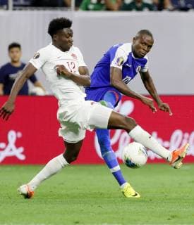 (190630) -- HOUSTON, JUNE 30, 2019 Haiti midfielder Wilde-Donald Guerrier (R) vies with Canada s midfielder Alphonso Davies during the CONCACAF Gold Cup soccer tournament quarterfinal between Haiti and Canada at NRG Stadium in Houston, Texas, the United States on June 29, 2019. Haiti won 3-2. ) (SP)US-HOUSTON-FOOTBALL-CONCACAF-GOLD CUP-HAITI VS CANADA SongxQiong 