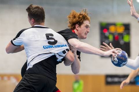 Kloten, Germany 30 June 2019 Handball, DHB U21 international Airport Trophy Switzerland vs Germany v left in duel Jonas Schelker Switzerland and Lukas Stutzke Germany Bayer Dormagen Kloten Sporthalle Ruebisbach Switzerland