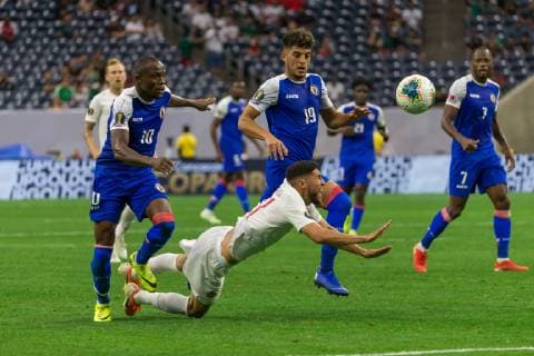 HOUSTON, TX - JUNE 29: Wilde-Donald Guerrier (10) of Haiti and Steeven Saba (19) of Haiti take down a Canada player during the Quarterfinals match between Haiti and Canada as part of the 2019 CONCACAF Gold Cup on June 29, 2019, at NRG Stadium in Houston, Texas. (Photo by David Buono Icon Sportswire) SOCCER: JUN 29 CONCACAF Gold Cup Quarterfinals - Haiti v Canada Icon190629021