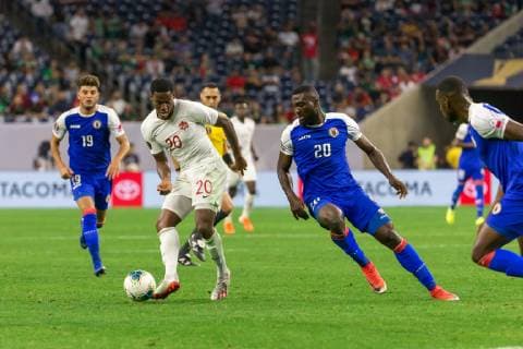 HOUSTON, TX - JUNE 29: Jonathan David (20) of Canada passes the ball during the Quarterfinals match between Haiti and Canada as part of the 2019 CONCACAF Gold Cup on June 29, 2019, at NRG Stadium in Houston, Texas. (Photo by David Buono Icon Sportswire) SOCCER: JUN 29 CONCACAF Gold Cup Quarterfinals - Haiti v Canada Icon190629042