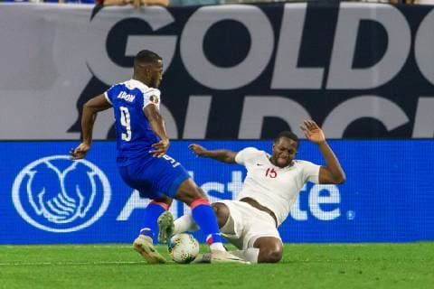 HOUSTON, TX - JUNE 29: Doneil Henry (15) of Canada makes a hard sliding tackle on Duckens Nazon (6) of Haiti during the Quarterfinals match between Haiti and Canada as part of the 2019 CONCACAF Gold Cup on June 29, 2019, at NRG Stadium in Houston, Texas. (Photo by David Buono Icon Sportswire) SOCCER: JUN 29 CONCACAF Gold Cup Quarterfinals - Haiti v Canada Icon190629044