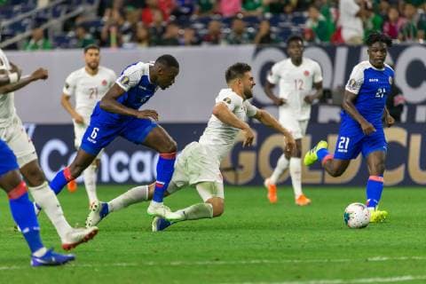HOUSTON, TX - JUNE 29: Jems Geffrard (6) of Haitim takes down a Canada player during the Quarterfinals match between Haiti and Canada as part of the 2019 CONCACAF Gold Cup on June 29, 2019, at NRG Stadium in Houston, Texas. (Photo by David Buono Icon Sportswire) SOCCER: JUN 29 CONCACAF Gold Cup Quarterfinals - Haiti v Canada Icon190629045