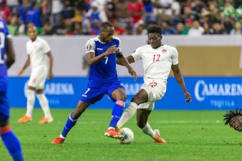 HOUSTON, TX - JUNE 29: Alphonso Davies (12) of Canada and Herve Bazile (7) of Haiti fight for the ball during the Quarterfinals match between Haiti and Canada as part of the 2019 CONCACAF Gold Cup on June 29, 2019, at NRG Stadium in Houston, Texas. (Photo by David Buono Icon Sportswire) SOCCER: JUN 29 CONCACAF Gold Cup Quarterfinals - Haiti v Canada Icon190629052