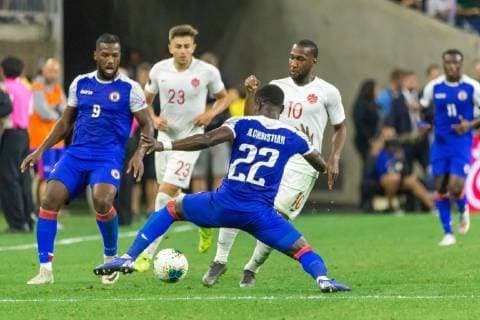 HOUSTON, TX - JUNE 29: Alex Christian (22) of Haiti tries to keep the ball from Canada player during the Quarterfinals match between Haiti and Canada as part of the 2019 CONCACAF Gold Cup on June 29, 2019, at NRG Stadium in Houston, Texas. (Photo by David Buono Icon Sportswire) SOCCER: JUN 29 CONCACAF Gold Cup Quarterfinals - Haiti v Canada Icon190629055