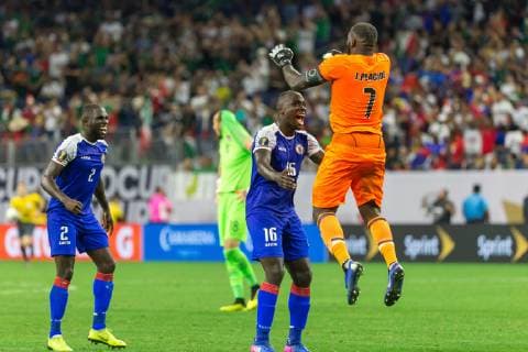 HOUSTON, TX - JUNE 29: Jhony Placide (1) of Haiti leaps into Andrew Jean Baptiste (16) of Haiti arms after winning the match over Canada during the Quarterfinals match between Haiti and Canada as part of the 2019 CONCACAF Gold Cup on June 29, 2019, at NRG Stadium in Houston, Texas. (Photo by David Buono Icon Sportswire) SOCCER: JUN 29 CONCACAF Gold Cup Quarterfinals - Haiti v Canada Icon190629057