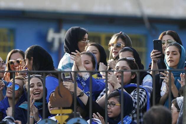 Iranian women sneak into soccer looks at his Esteghlal players ahead of before start the Persian Gulf Pro League 2019 2020,women who are already forbidden from watching the games in stadiums, on Jul 2, 2019, at in Tehran (photographer Amirhossein Kheirkhah) 