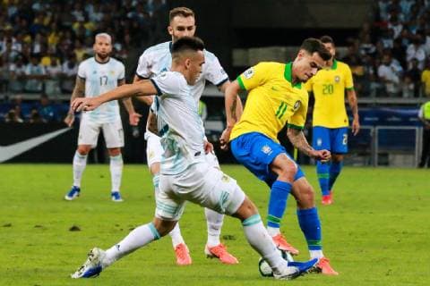 Brazil vs. Argentina BELO HORIZONTE, MG - 02.07.2019: BRAZIL VS. ARGENTINA - Philippe Coutinho, from Brazil, is signed by Argentina& 39;s Lautaro Martinez during a match between Brazil and Argentina, valid for semi-final of the Copa America 2019, held tld this Tuesday (02) at the Estádio do Mineirão in Belo Horizonte, MG. (Photo: Dudu Macedo Fotoarena) x1757511x  DuduxMacedo