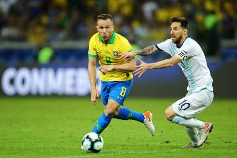 July 2nd 2019, Mineirao, Belo Horizonte, Brazil; Copa America International football, semi final, Brazil versus Argentina; Arthur of Brazil is grapppled by Lionel Messi of Argentina  ActionPlus12150065 HeulerxAndrey