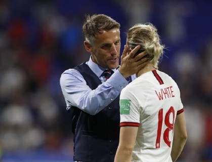(190703) -- LYON, July 3, 2019 -- Head Coach Philip Neville (L) of England talks with player Ellen White after the semifinal between the United States and England at the 2019 FIFA Women s World Cup at Stade de Lyon in Lyon, France on July 2, 2019. ) (SP)FRANCE-LYON-FOOTBALL-FIFA WOMEN S WORLD CUP-SEMIFINALS-ENG VS USA DingxXu 