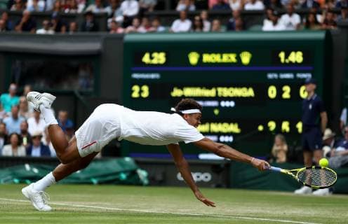 Sport Bilder des Tages 6th July 2019, The All England Lawn Tennis and Croquet Club, Wimbledon, England, Wimbledon Tennis Tournament, Day 6; Jo-Wilfried Tsonga (FRA) dives for the ball to return to Rafael Nadal (ESP)  ActionPlus12151273 ShaunxBrooks
