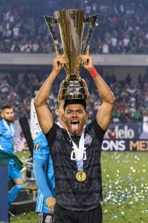 CHICAGO, IL - JULY 07: Mexico midfielder Jesus Gallardo (23) stands with the trophy after the CONCACAF Gold Cup final match between the United States and Mexico on July 07, 2019, at Soldier Field in Chicago, IL. (Photo By Daniel Bartel Icon Sportswire) SOCCER: JUL 07 CONCACAF Gold Cup Finals - USA v Mexico Icon190707027