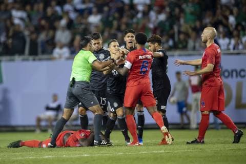 CHICAGO, IL - JULY 07: Players fight during the CONCACAF Gold Cup final match between the United States and Mexico on July 07, 2019, at Soldier Field in Chicago, IL. (Photo By Patrick Gorski Icon Sportswire) SOCCER: JUL 07 CONCACAF Gold Cup Finals - USA v Mexico Icon07071921