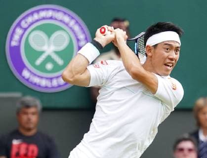 Tennis: Wimbledon championships Japan s Kei Nishikori in action against Roger Federer of Switzerland in their Wimbledon quarterfinal on July 10, 2019. 