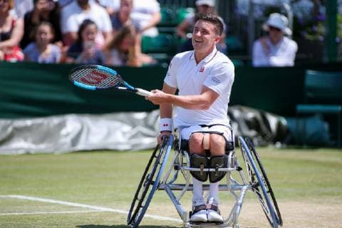 Gordon Reid of Great Britain during the men s wheelchair singles quarter-final match of the Wimbledon Lawn Tennis Championships against Shingo Kunieda of Japan at the All England Lawn Tennis and Croquet Club in London, England on July 11, 2019.  (107759817)