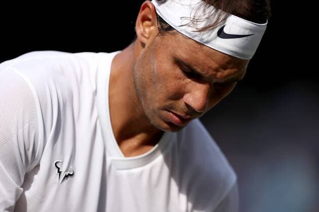 12th July 2019, The All England Lawn Tennis and Croquet Club, Wimbledon, England, Wimbledon Tennis Tournament, Day 11; Rafael Nadal (ESP) gets ready to serve during his match with Roger Federer (SUI)  ActionPlus12153204 ShaunxBrooks