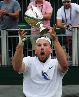 Tennis - 2019 Wimbledon Championships - Week Two, Saturday (Day Twelve) Men s Final of the Quad Wheelchair singles Dylan Alcot (AUS) v Andy Lapthorne (GBR) Dylan Alcot celebrates by throwing the trophy in the air, on Court 12. COLORSPORT ANDREW COWIE 