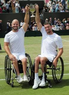 Tennis - 2019 Wimbledon Championships - Week Two, Saturday (Day Twelve) Men s Final of the Wheelchair doubles Alfie Hewett and Gordon Reid (GBR) v Joachim Gerard (BEL) v Stefan Olsson (SWE) Joachim Gerard v Stefan Olsson with the trophy on Court 3. COLORSPORT ANDREW COWIE 