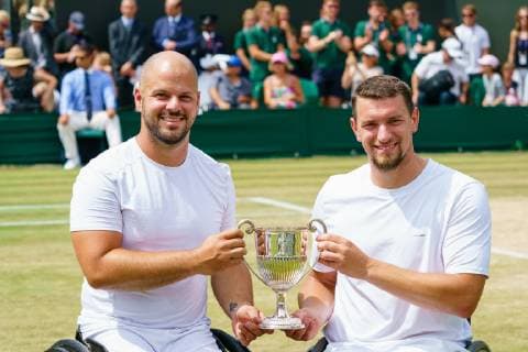 Belgian Joachim Gerard (R) and Swedish Stefan Olsson celebrate with the cup as they won the final of the men s wheelchair doubles final against British pair Alfie Hewitt and Gordon Reid at the 2019 Wimbledon grand slam tennis tournament at the All England Tennis Club, in south-west London, Britain, Saturday 13 July 2019. PETERxVANxDENxBERG  x05625363x