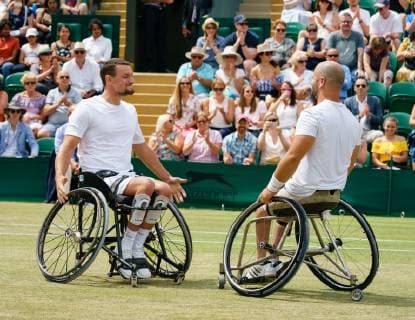 Belgian Joachim Gerard (L) and Swedish Stefan Olsson celebrate with the cup as they won the final of the men s wheelchair doubles final against British pair Alfie Hewitt and Gordon Reid at the 2019 Wimbledon grand slam tennis tournament at the All England Tennis Club, in south-west London, Britain, Saturday 13 July 2019. PETERxVANxDENxBERG  x05625361x