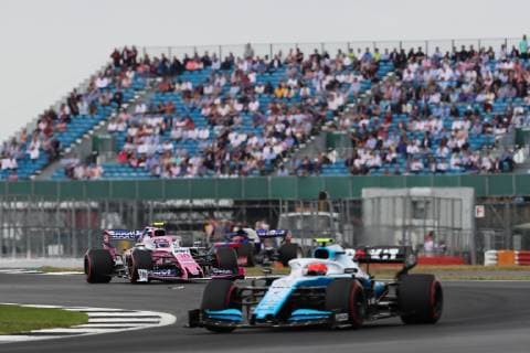 13th July 2019, Silverstone Circuit. Northampton, England; FIA Formula 1 Grand Prix of Britain, Qualification Day; Lance Stroll driving his SportPesa Racing Point F1 Team RP19 chases down Robert Kubica driving his ROKiT Williams Racing FW42  ActionPlus12153544 TimxWilliams