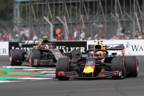 13th July 2019, Silverstone Circuit. Northampton, England; FIA Formula 1 Grand Prix of Britain, Qualification Day; Pierre Gasly driving his Aston Martin Red Bull Racing RB15 ahead of Kevin Magnussen driving his Rich Energy Haas F1 Team VF-19  ActionPlus12153536 TimxWilliams