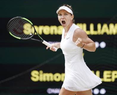 Tennis: Wimbledon championships Simona Halep of Romania reacts after winning a point during her Wimbledon final against Serena Williams of the United States on July 13, 2019. 