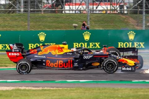 14th July 2019; Silverstone Circuit, Northampton, England; FIA F1 Grand Prix of Britain, Race Day; Aston Martin Red Bull Racing driver Max Verstappen bounces over the kerbs after being hit by Scuderia Ferrari driver Sebastian Vettel  ActionPlus12153792 TimxWilliams