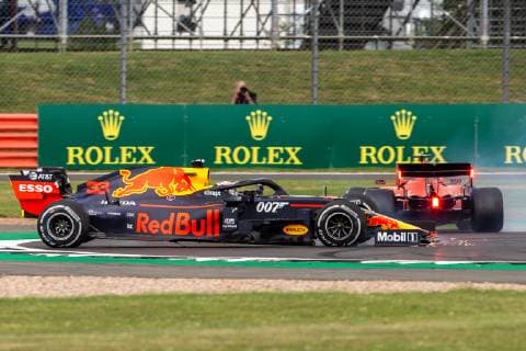 14th July 2019; Silverstone Circuit, Northampton, England; FIA F1 Grand Prix of Britain, Race Day; Aston Martin Red Bull Racing driver Max Verstappen spins after being hit by Scuderia Ferrari driver Sebastian Vettel  ActionPlus12153793 TimxWilliams