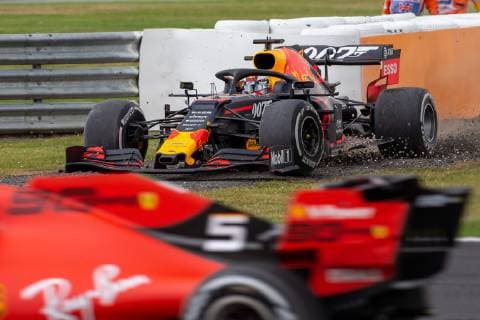 14th July 2019; Silverstone Circuit, Northampton, England; FIA F1 Grand Prix of Britain, Race Day; Aston Martin Red Bull Racing driver Max Verstappen drives out of the gravel as Scuderia Ferrari driver Sebastian Vettel drives past after pushing him off track  ActionPlus12153795 TimxWilliams