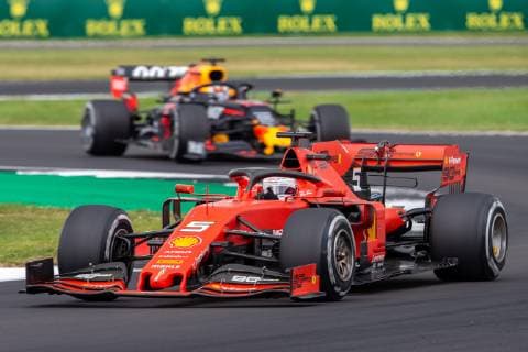 14th July 2019; Silverstone Circuit, Northampton, England; FIA F1 Grand Prix of Britain, Race Day; Sebastian Vettel driving his Scuderia Ferrari Mission Winnow SF90 ahead of Max Verstappen driving his Aston Martin Red Bull Racing RB15  ActionPlus12153908 TimxWilliams