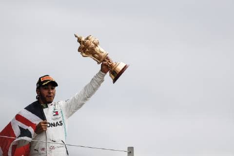 July 14, 2019 - Towcester, Great Britain - LEWIS HAMILTON of Mercedes AMG Petronas Motorsport on the podium after winning the Formula 1 British Grand Prix at Silverstone Circuit. F1 2019: British Grand Prix: Hamilton Wins  - ZUMAtish 20190714_mda_g147_254 Copyright: xJamesxGasperottix