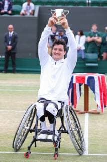 Gustavo Fernandez of Argentina poses with the trophy after winning the men s wheelchair singles final match of the Wimbledon Lawn Tennis Championships against Shingo Kunieda of Japan at the All England Lawn Tennis and Croquet Club in London, England on July 14, 2019.  (107962062)