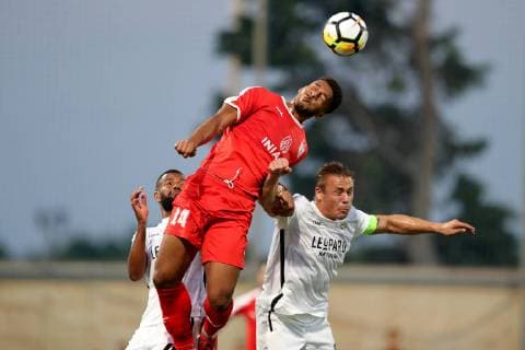 Valletta FC striker Kyrian Nwoko (L) is challenged by F91 Dudelange captain Tom Schnell (R) clears his lines during the UEFA Champions League, First Qualifying Round, 2nd leg match between the two teams at the Centenary Stadium, Ta Qali, Malta on 16 July, 2019. Valletta FC v Dudelange UCL_19_20