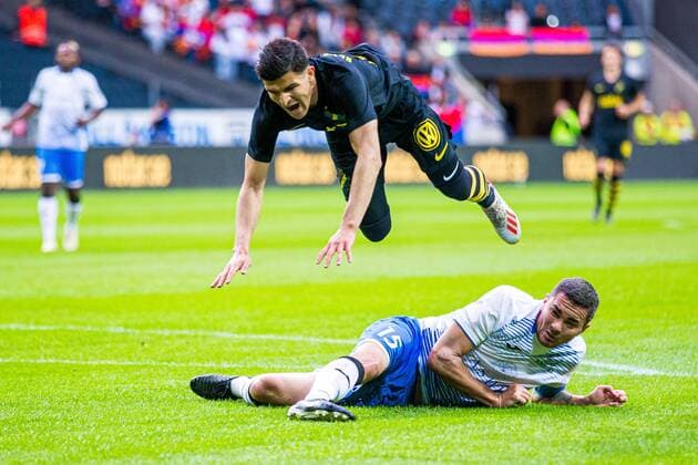 190717 AIKs Tarik Elyounoussi and Ararat Armenias Guz during the Champions League qualifying match between AIK and FC Ararat Armenia on July 17, 2019 in Stockholm,  Copyright: KENTAxJÖNSSON ST190717AAB06