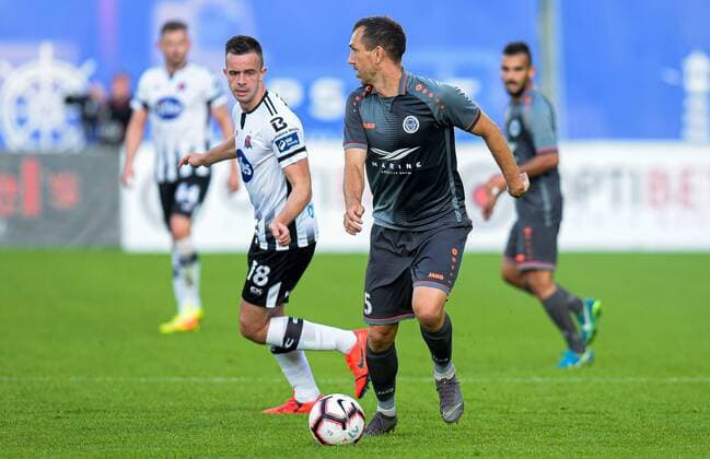 UEFA Champions League Second Qualifying Round First Leg, Skonto Stadium, Riga, Latvia 17 72019 Riga FC vs Dundalk Dundalk s Robbie Benson with Olegs Laizans of Riga Robbie Benson with Olegs Laizans 17 7 2019  Copyright: x©INPHO LETAx DSC_6638