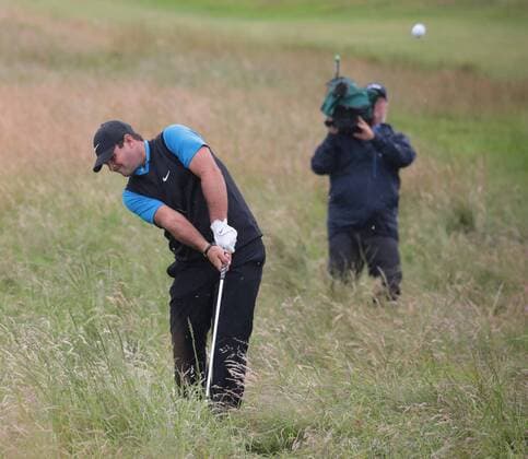 Patrick Reed of US hits out of the rough on the 16th hole on the 2nd day of the Open Championship at Royal Portrush on Friday, July 19, 2019. Reed finished four shots under par.  LON2019071918 HUGOxPHILPOTT