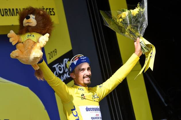 French Julian Alaphilippe of Deceuninck - Quick-Step celebrates on the podium in the yellow jersey of leader in the overall ranking after stage 14 of the 106th edition of the Tour de France cycling race, from Tarbes to Tourmalet Bareges (117,5km), in France, Saturday 20 July 2019. This year s Tour de France starts in Brussels and takes place from July 6th to July 28th. DAVIDxSTOCKMAN  x05630855x