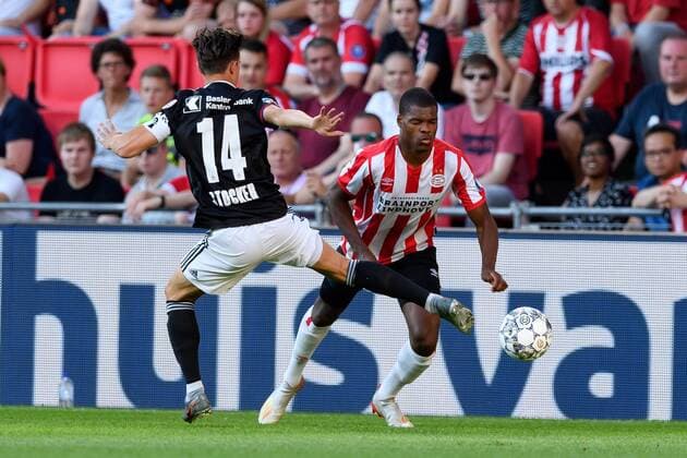 Eindhoven, Netherlands, 24 07 2019, UEFA Champions League, Second qualifying round, PSV Eindhoven FC Basel , Valentin Stocker Basel and Denzel Dumfries PSV in the duel, battle for the ball Defodi 01001216525 Defodi-001