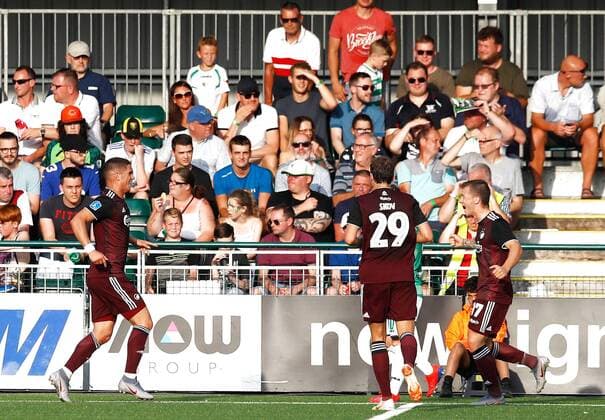 Copenhagen s Pieros Sotiriou left celebrates scoring his side s first goal of the game with team mates during the UEFA Champions League second qualifying round first leg match at Park Hall Stadium, Oswestry , Oswestry Denmark,  Copyright: PAxWire PAxImages MartinxRickettx cop333 spdk20190723-203028-L