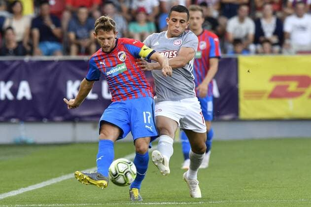 From left soccer players PATRIK HROSOVSKY of Viktoria and OMAR ELABDELLAOUI of Olympiakos in action during the Football Champions League 2nd qualifying round match: Viktoria Plzen vs Olympiakos Piraeus in Pilsen, Czech Republic, July 23, 2019. (CTKxPhoto VitxSimanek) CTKPhotoP201907230852801  _VIS4897