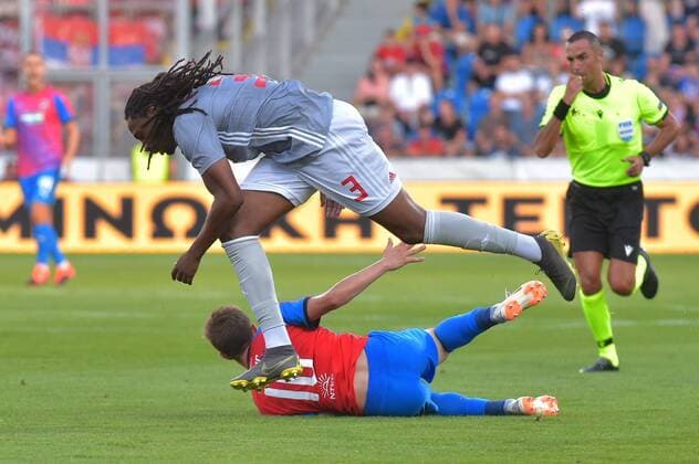 Up - soccer players ANDREAS BOUCHALAKIS of Olympiakos and JAN KOPIC of Viktoria (down) in action during the Football Champions League 2nd qualifying round match: Viktoria Plzen vs Olympiakos Piraeus in Pilsen, Czech Republic, July 23, 2019. (CTKxPhoto MiroslavxChaloupka) CTKPhotoP201907230877301  _CHA8717