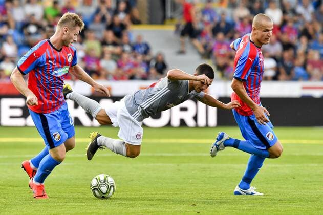 From left soccer players of Viktoria JAKUB BRABEC, DANIEL PODENCE of Olympiakos and ADAM HLOUSEK of Viktoria in action during the Football Champions League 2nd qualifying round match: Viktoria Plzen vs Olympiakos Piraeus in Pilsen, Czech Republic, July 23, 2019. (CTKxPhoto VitxSimanek) CTKPhotoP201907230892501  VIS 002