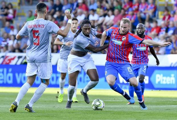 From left soccer players of Olympiakos ANDREAS BOUCHALAKIS, RUBEN SEMEDO, MICHAEL KRMENCIK, JOEL KAYAMBA both of Viktoria in action during the Football Champions League 2nd qualifying round match: Viktoria Plzen vs Olympiakos Piraeus in Pilsen, Czech Republic, July 23, 2019. (CTKxPhoto VitxSimanek) CTKPhotoP201907230895201  VIS 003
